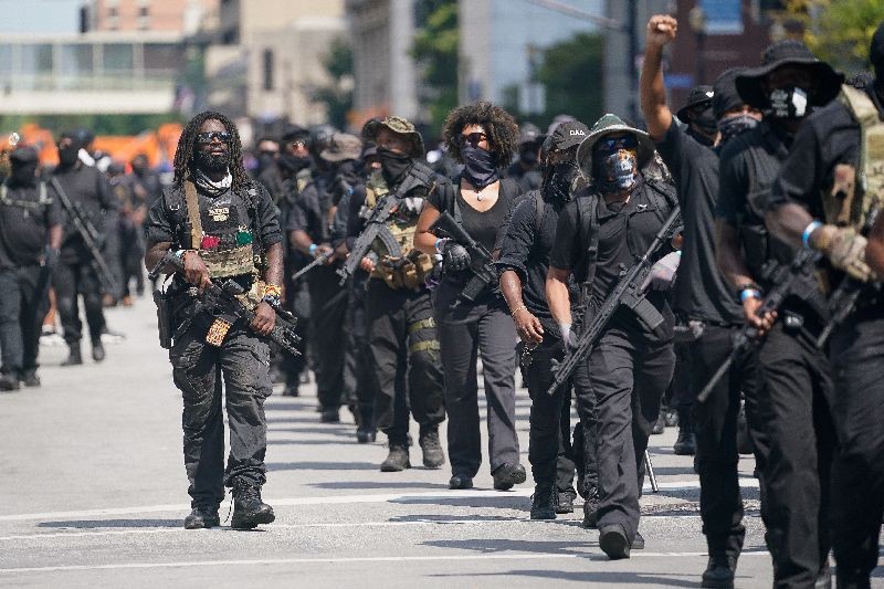 Members of an all-Black militia group called NFAC hold an armed rally in Louisville, Kentucky, U.S. July 25, 2020. REUTERS/Bryan Woolston